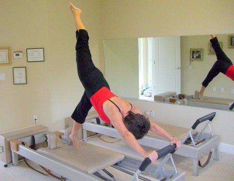 Pilates arabesque on the Reformer